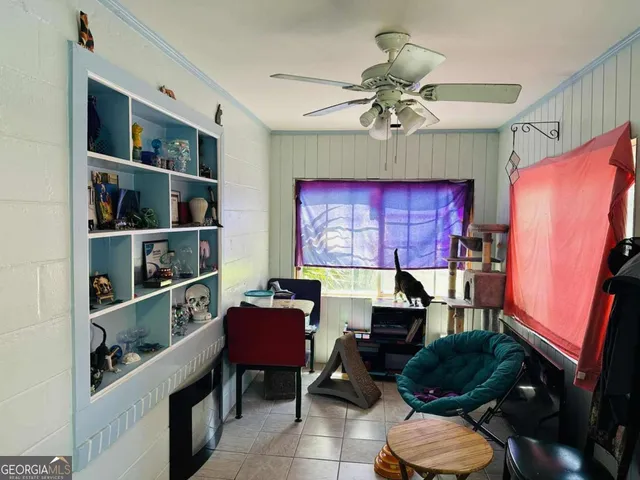 a workspace with furniture window and wooden floor