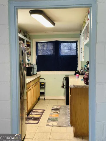 a kitchen with stainless steel appliances granite countertop a sink and cabinets