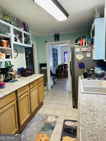 a living room with lots of furniture and a chandelier