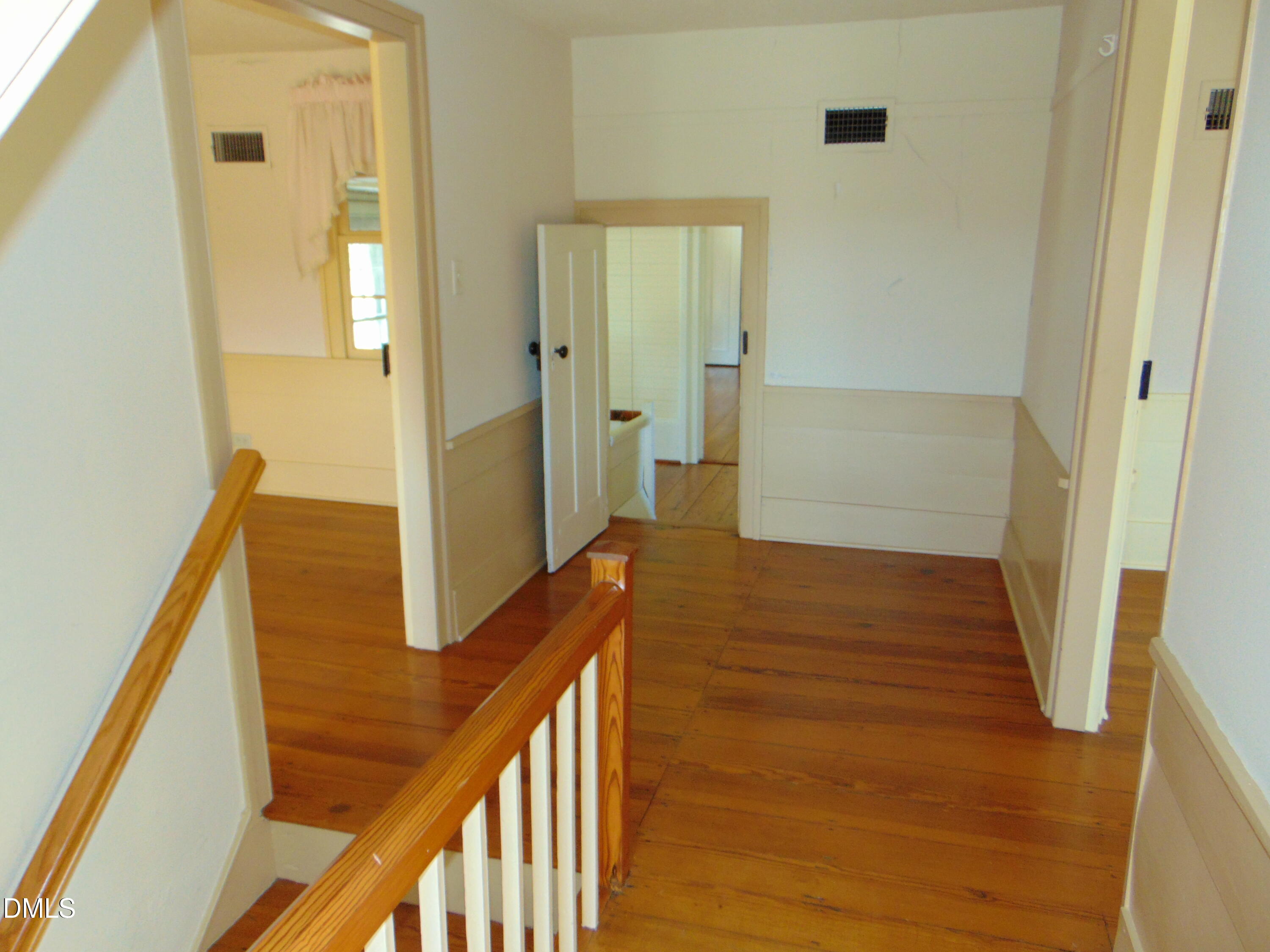 4067 Chewning Road Oxford, NC 27565 - Photo 68 of 82 a view of a hallway with wooden floor and staircase