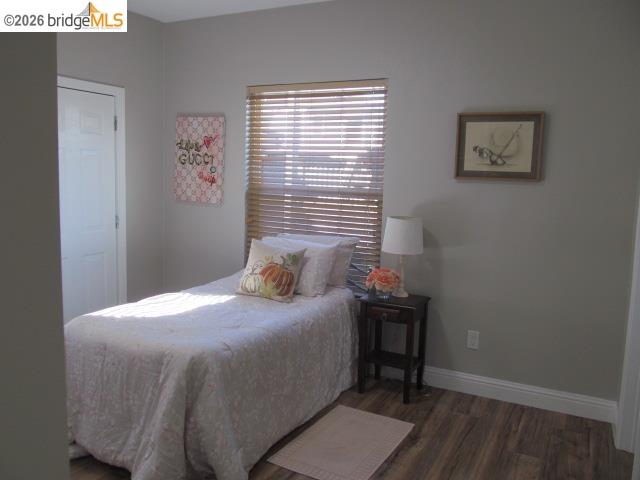 2807 Filbert Street Oakland, CA 94608 - Photo 11 of 12 a bedroom with a bed and a window