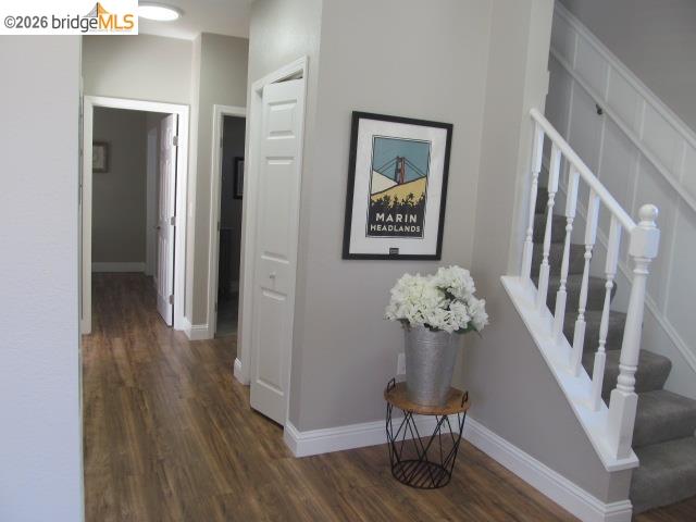 2807 Filbert Street Oakland, CA 94608 - Photo 5 of 12 a view of a hallway with wooden floor and staircase