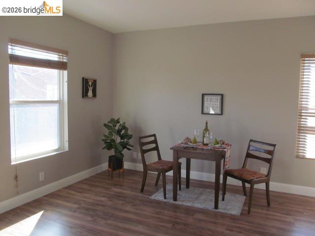 2807 Filbert Street Oakland, CA 94608 - Photo 7 of 12 a dining room with furniture and wooden floor