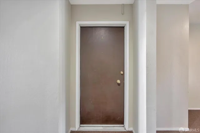 a view of a kitchen with wooden floor and a sink