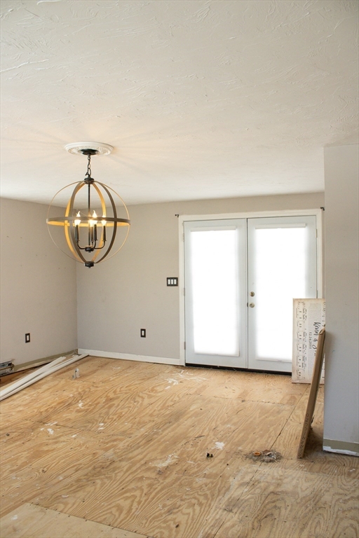 25 Bear Hill Road Gardner, MA 01440 - Photo 12 of 39 a view of an empty room with wooden floor and a window