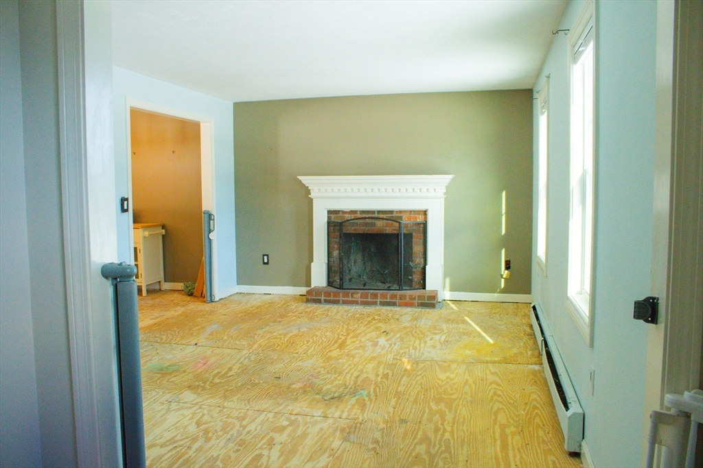 25 Bear Hill Road Gardner, MA 01440 - Photo 18 of 39 a view of an empty room with a fireplace