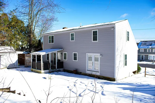 a view of a house with snow on the road