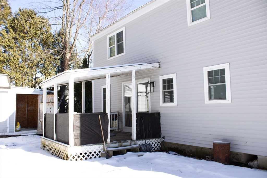 25 Bear Hill Road Gardner, MA 01440 - Photo 5 of 39 a view of a house with a barbeque and wooden fence