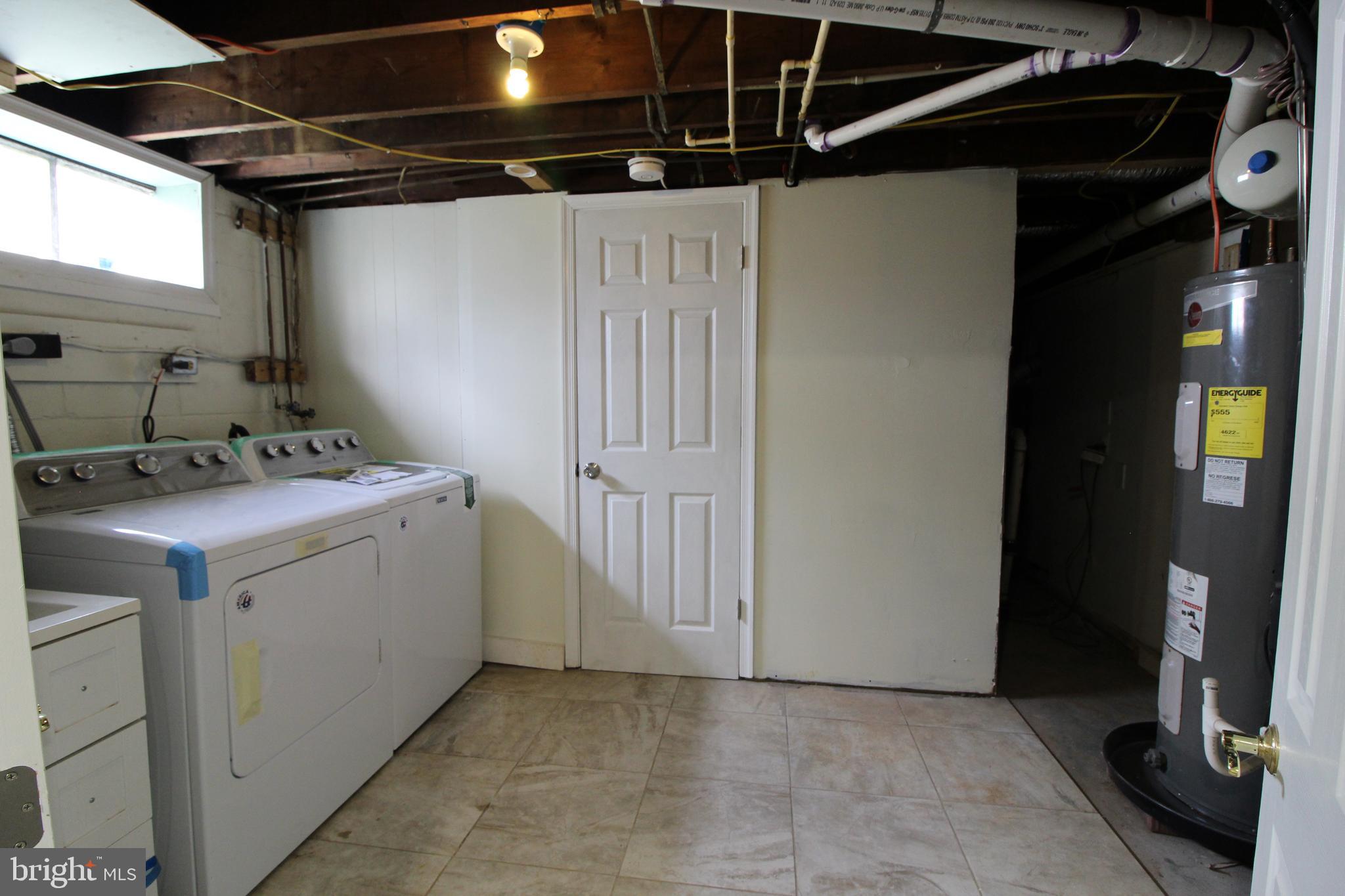 7300 Castlemoor Road Baltimore, MD 21244 - Photo 24 of 40 Lower level Utility room with new washer and dryer