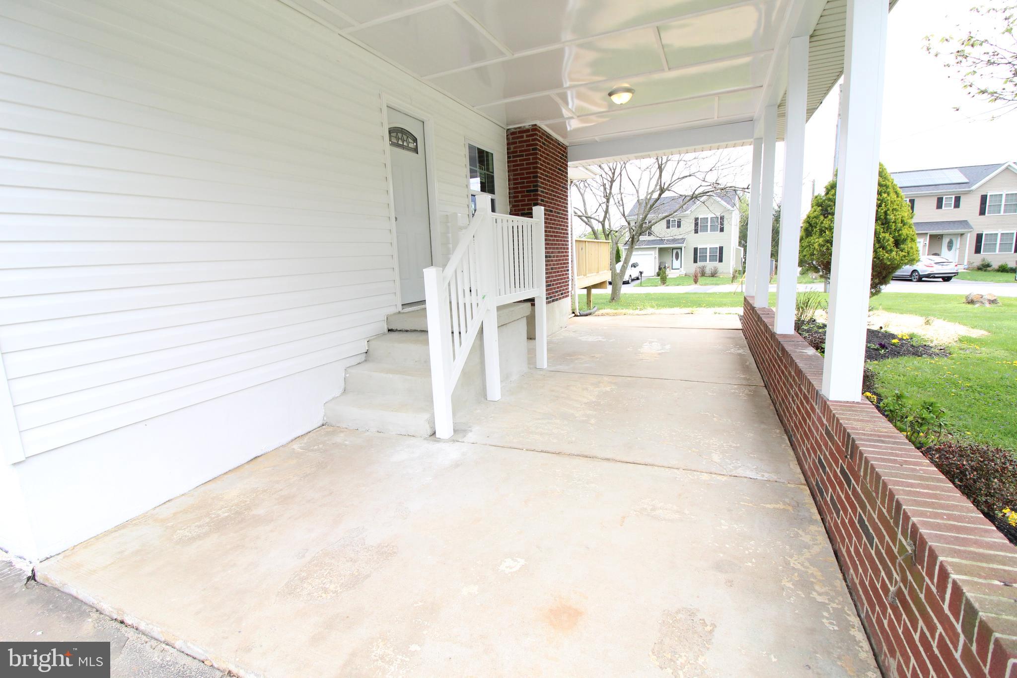 7300 Castlemoor Road Baltimore, MD 21244 - Photo 6 of 40 Covered Front Porch and concrete patio