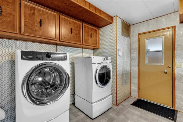 a utility room with dryer and washer