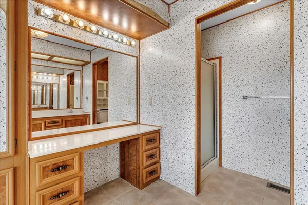 a bathroom with a tub and shower