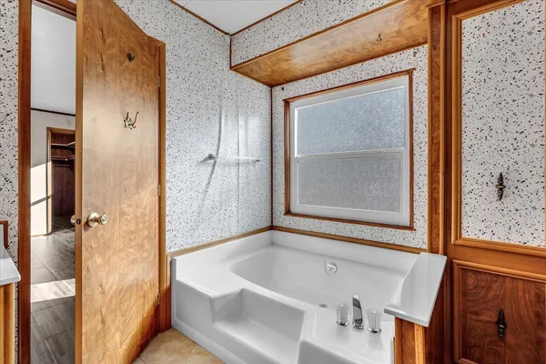 a bathroom with a double vanity sink and mirror