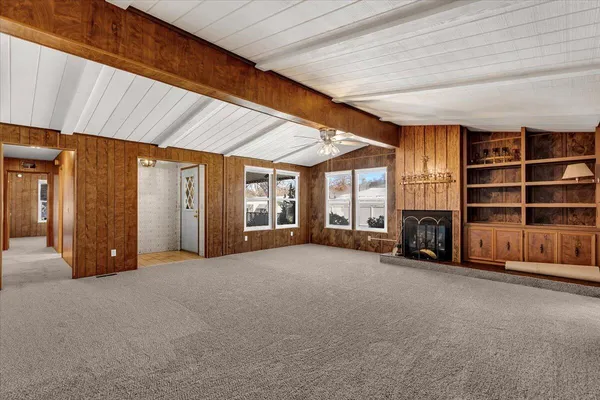 a view of a room with furniture and windows