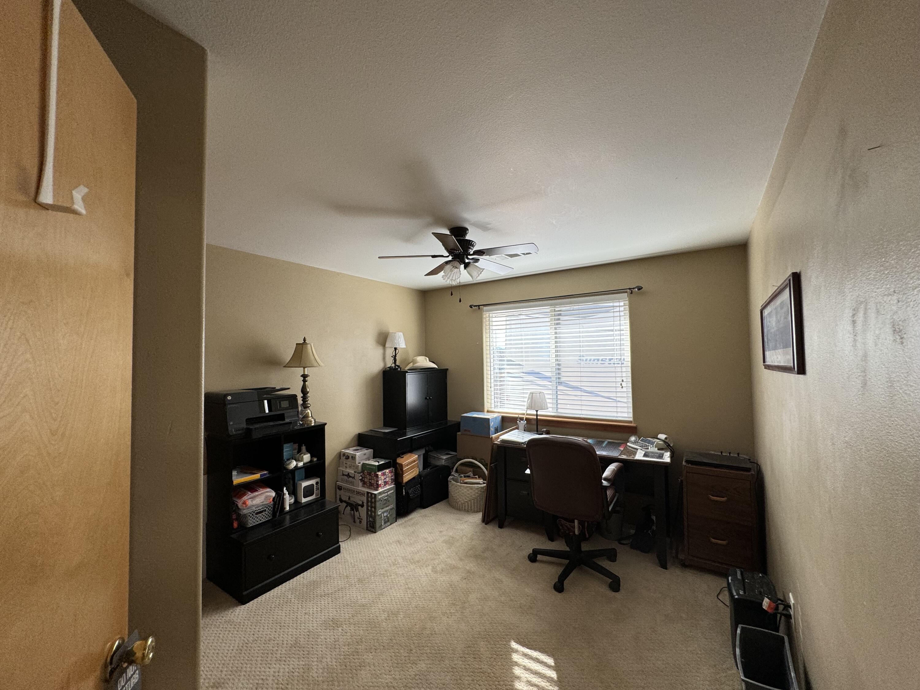 896 Ridgeview Drive Eagle Point, OR 97524 - Photo 11 of 17 a view of a workspace with furniture and a window