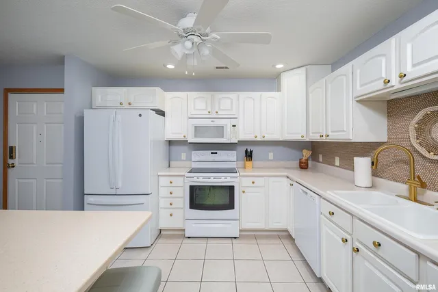 a bedroom with a bed and a table