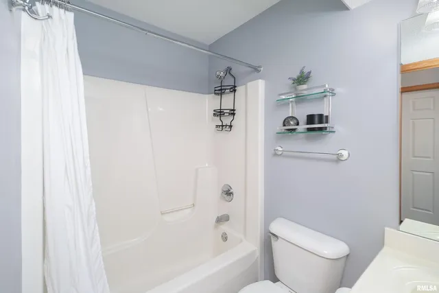 a bathroom with a sink vanity and a mirror
