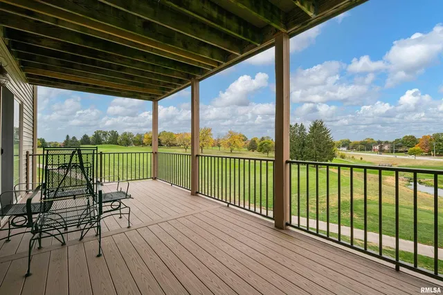 a view of roof deck with wooden floor and outdoor seating