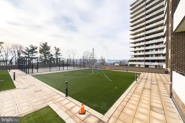 a view of a swimming pool with a patio
