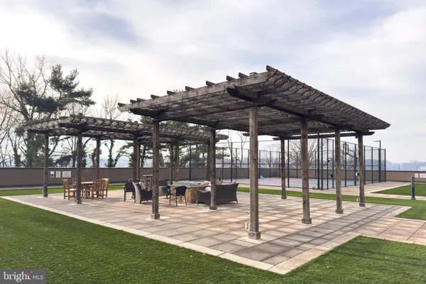a view of a patio with a dining table and chairs