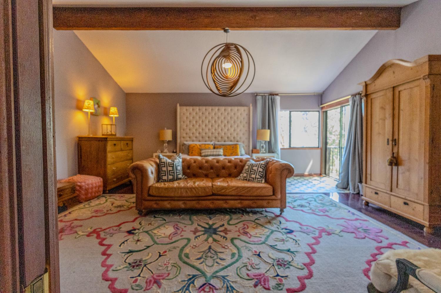 27689 Table Meadow Road Auburn, CA 95602 - Photo 29 of 72 a living room with furniture a clock and a rug