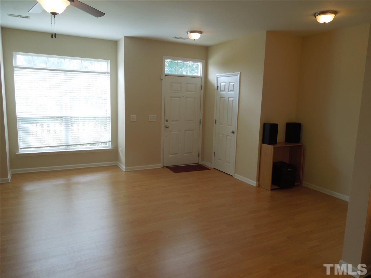 320 Gilman Lane, Unit 108 Raleigh, NC 27610 - Photo 2 of 22 Open first floor living area with nice laminate floors