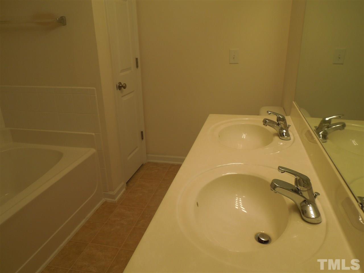 320 Gilman Lane, Unit 108 Raleigh, NC 27610 - Photo 17 of 22 Master bath has dual vanity on third floor