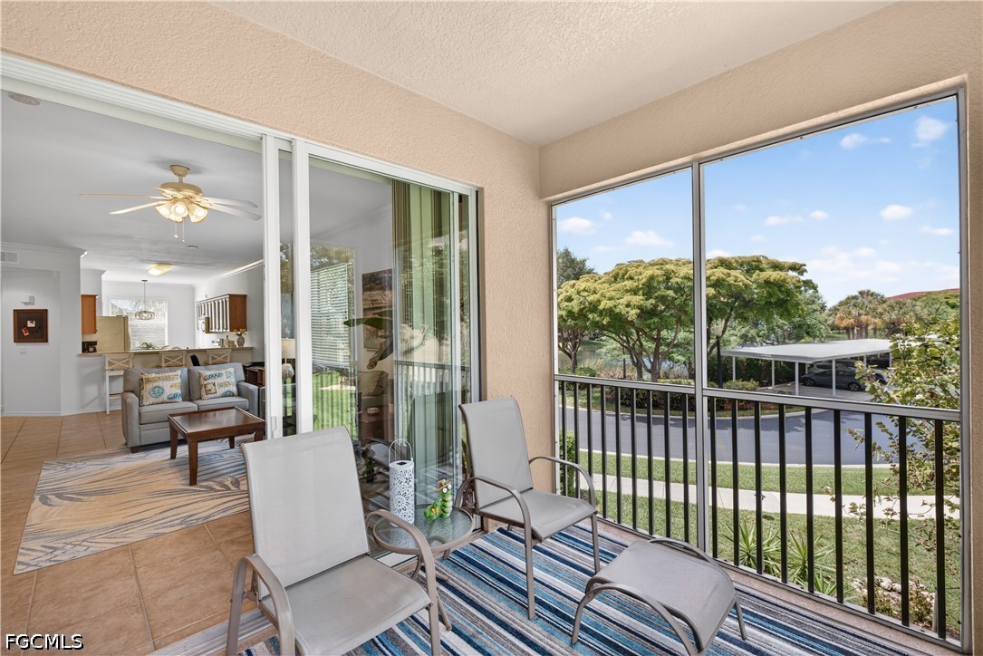 8251 Pathfinder Loop, Unit 621 Fort Myers, FL 33919 - Photo 26 of 30 a view of a balcony with chairs