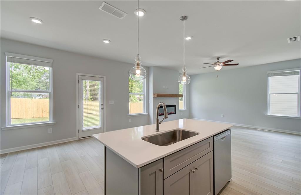 117 Alpine Road Fairburn, GA 30213 - Photo 14 of 29 a kitchen with a sink a counter space and a window
