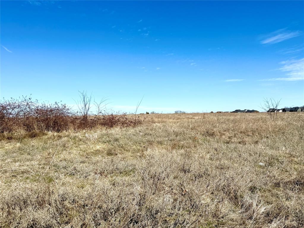 Tbd Dixie Road Whitesboro, TX 76273 - Photo 14 of 18 a view of a lake with a building in the background