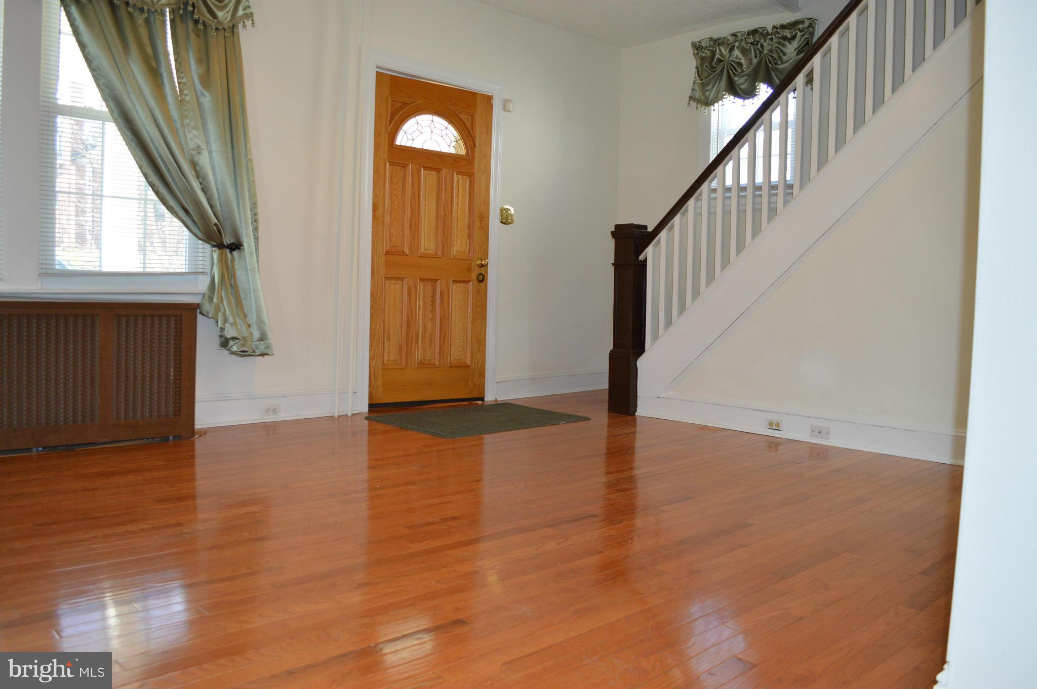 3804 Ridgecroft Road Baltimore, MD 21206 - Photo 5 of 24 Living Room offers an updated oak front door