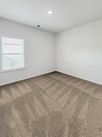 a bathroom with a granite countertop sink toilet a mirror and bathtub