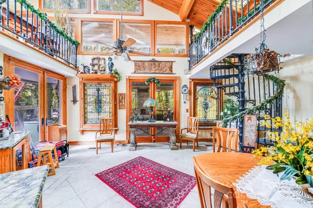 a view of a swimming pool with outdoor seating