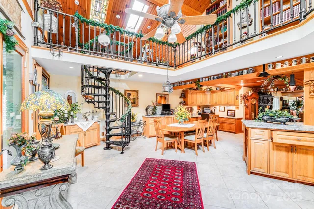 a large kitchen with stainless steel appliances granite countertop a sink and cabinets