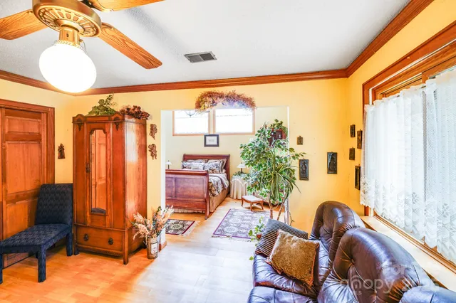 a bedroom with furniture and a window