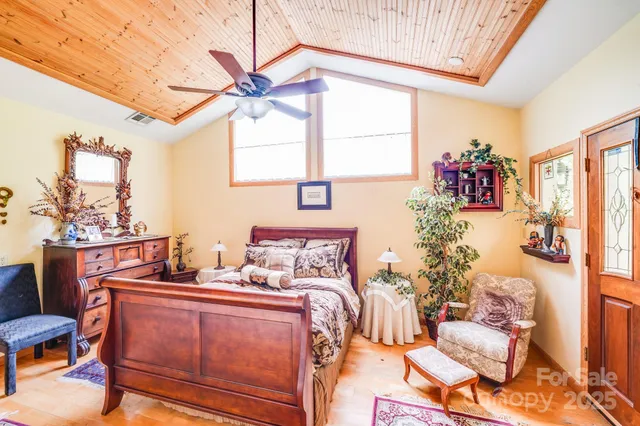 a bedroom with furniture and window