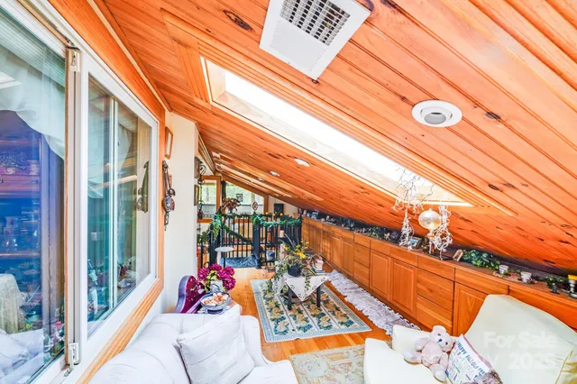 a view of balcony with wooden floor