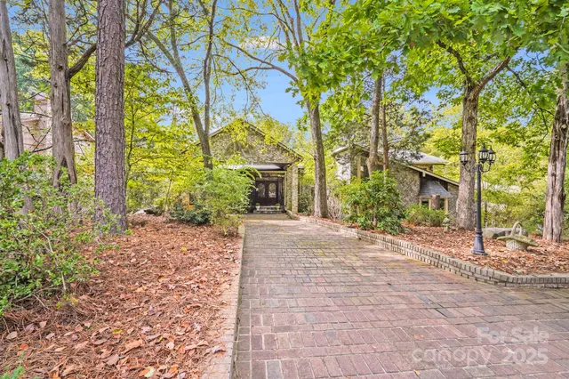 a view of a porch with a table and chairs under an umbrella