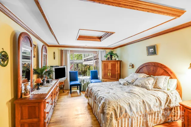 a bedroom with a bed couch and a window