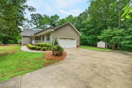 3913 Level Plains Road Sophia, NC 27350 - Photo 2 of 43 Paved driveway leading to a double garage