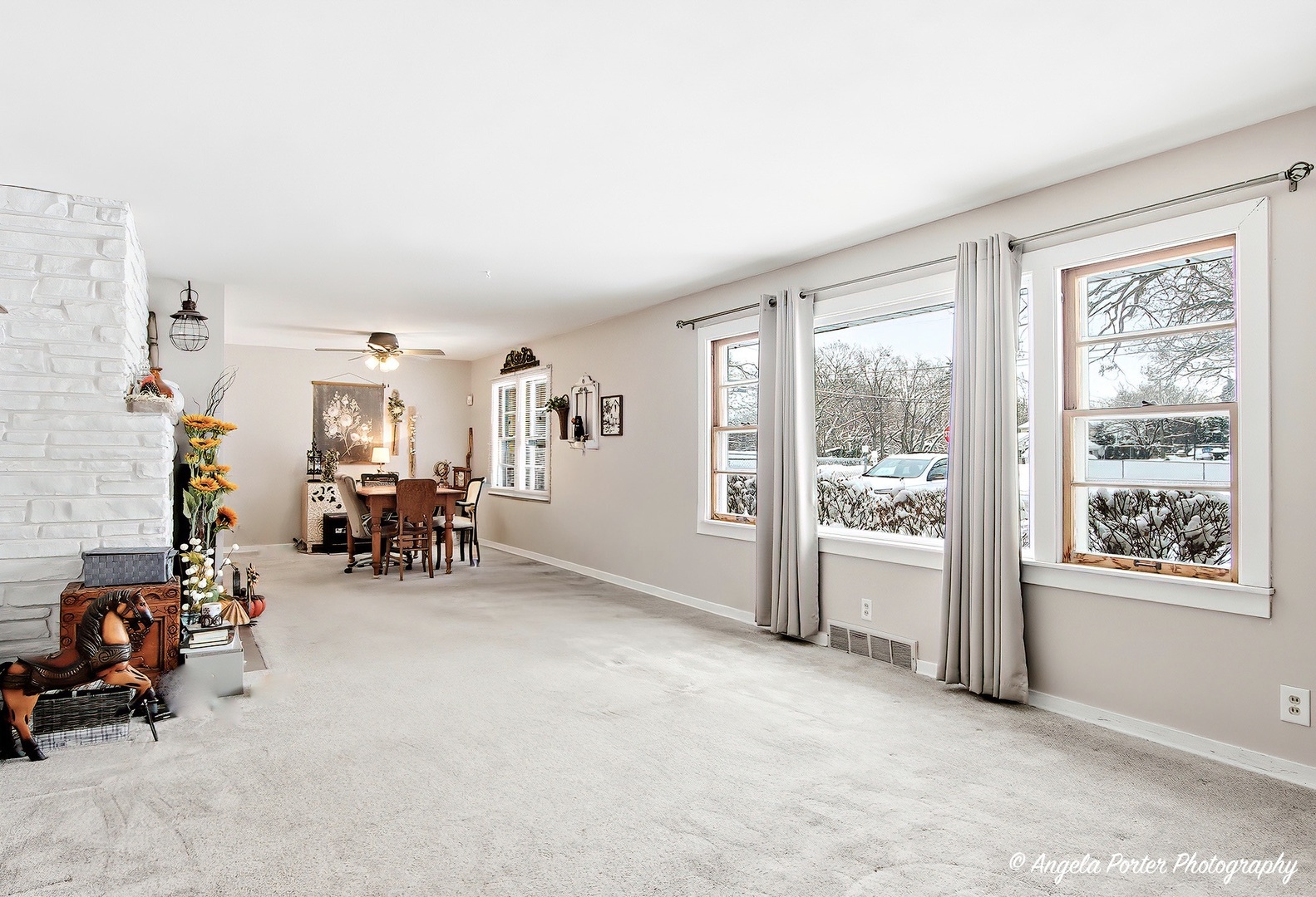 50 East Oak Street Fox Lake, IL 60020 - Photo 4 of 16 a view of a livingroom with lounge chair and a large window