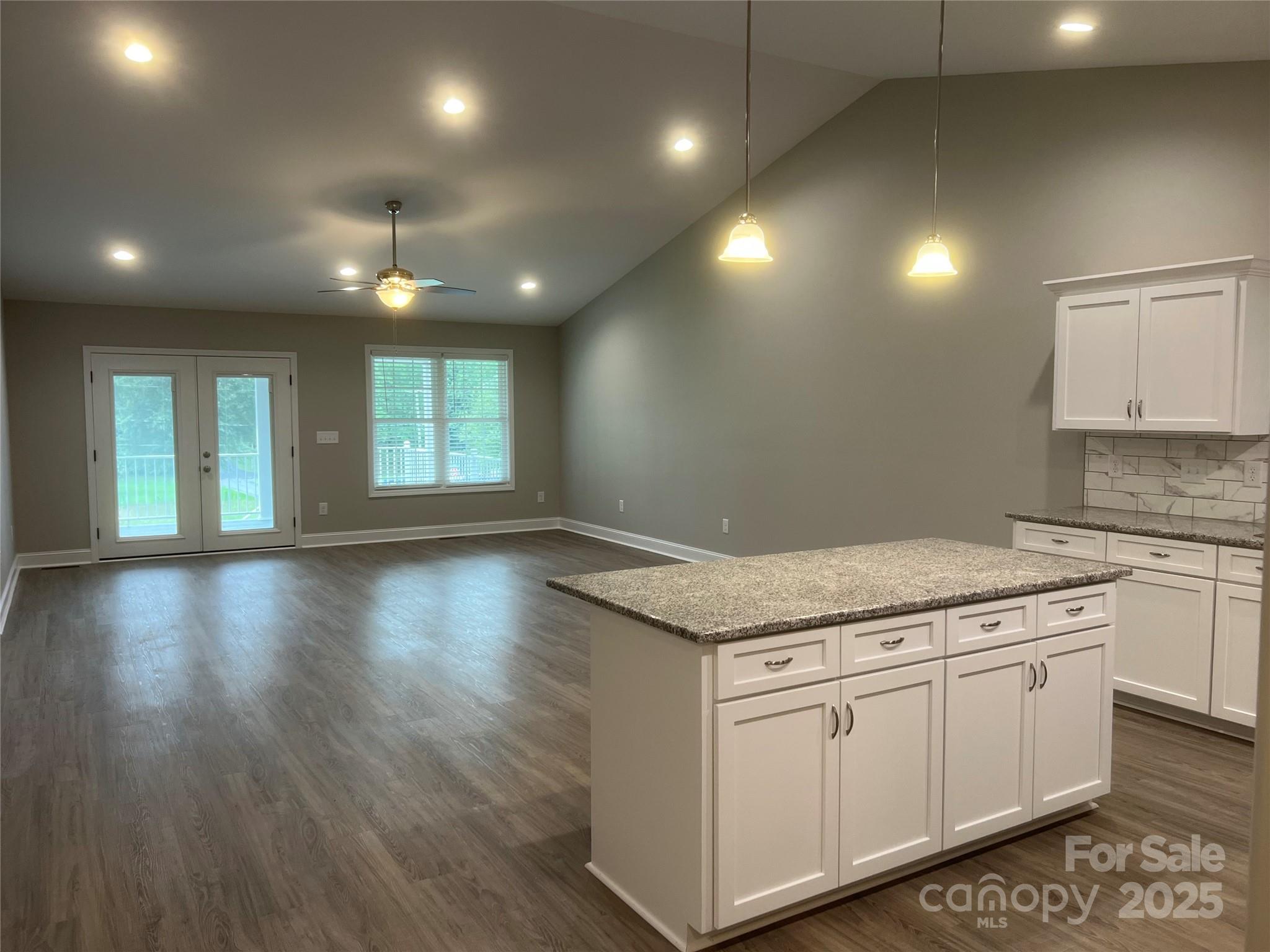 302 East Boyd Street, Unit B Maiden, NC 28650 - Photo 2 of 12 a kitchen with granite countertop white cabinets and white appliances