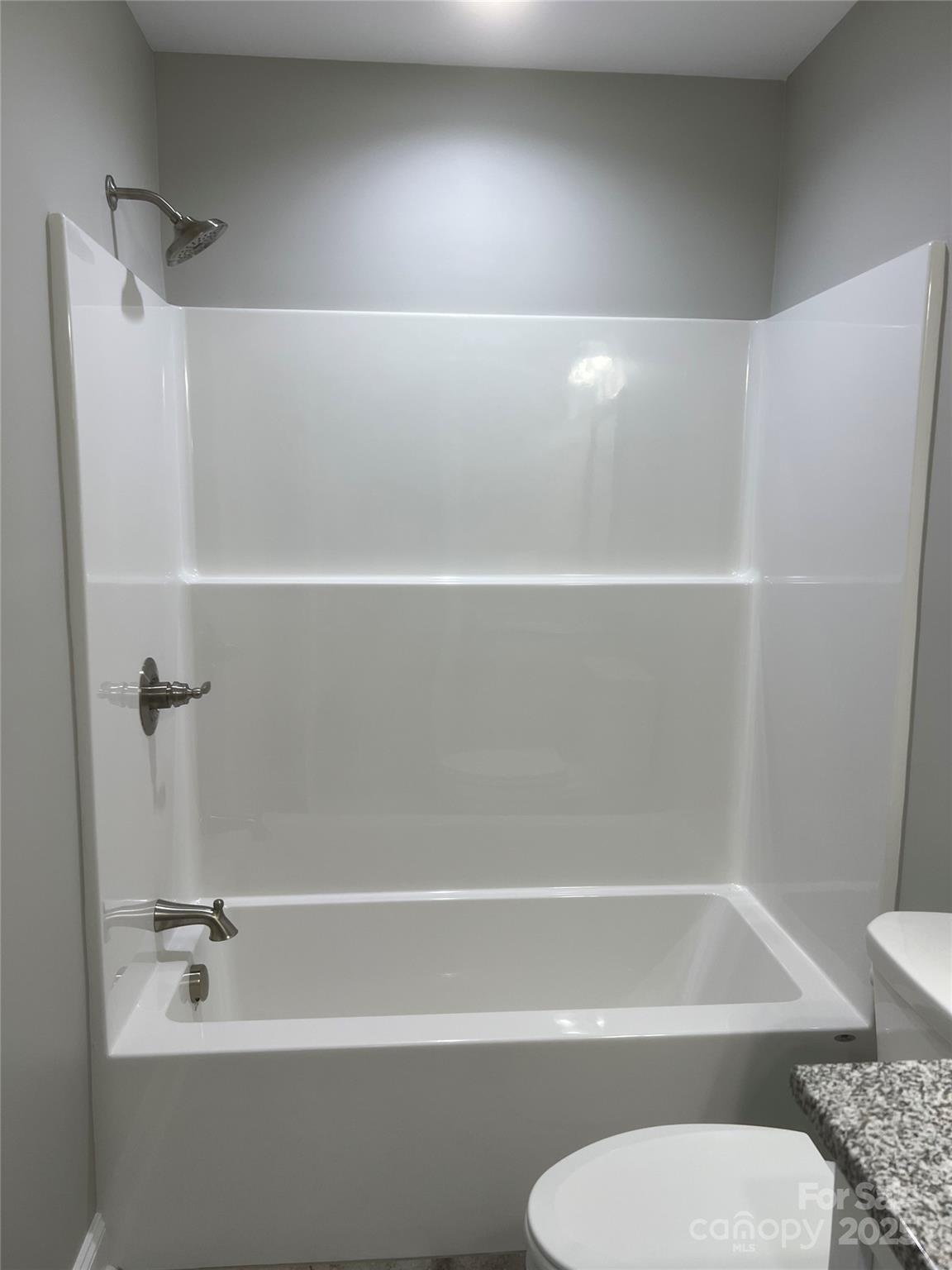 302 East Boyd Street, Unit B Maiden, NC 28650 - Photo 7 of 12 a bathroom with a shower and a toilet