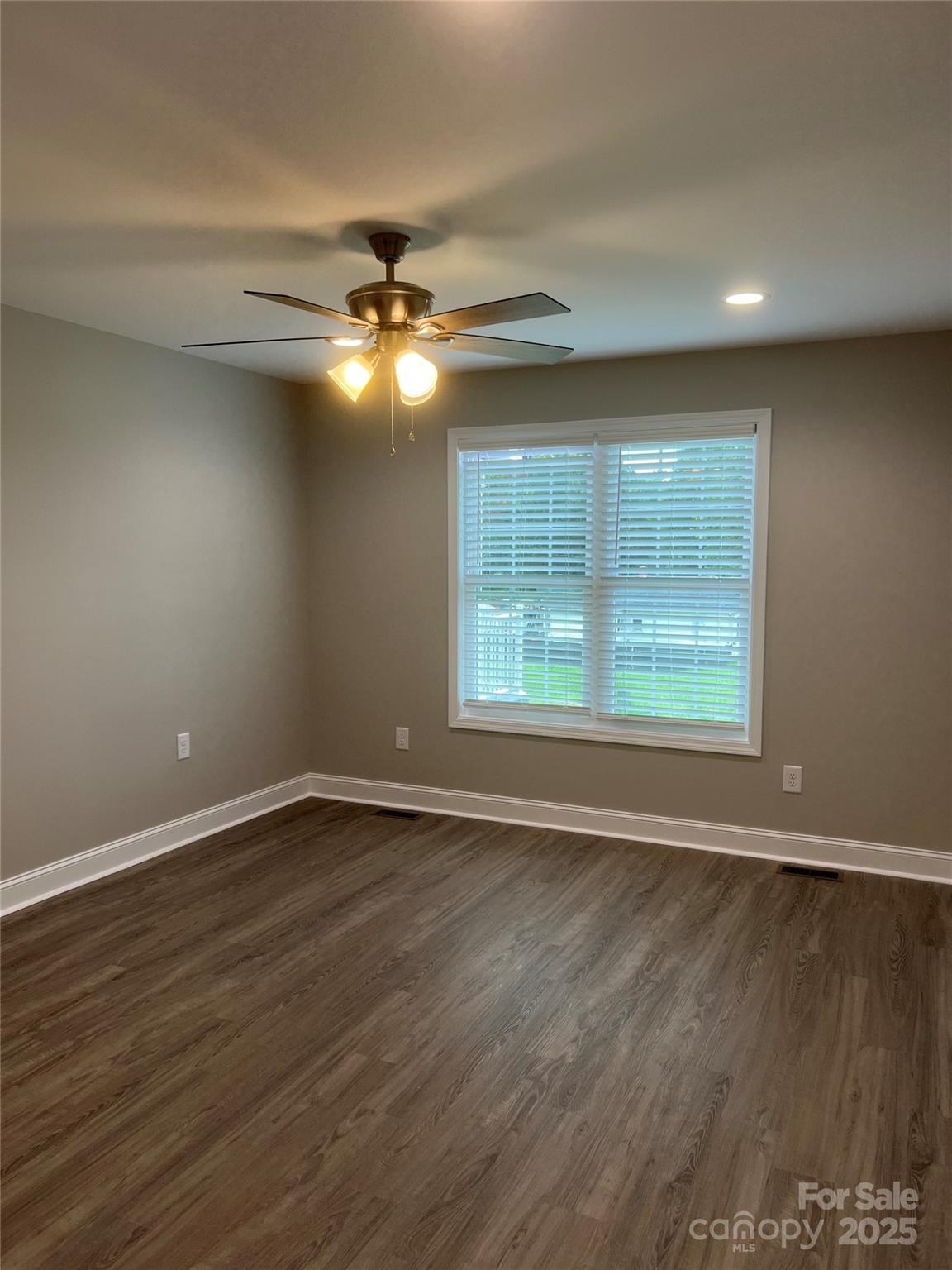 302 East Boyd Street, Unit B Maiden, NC 28650 - Photo 8 of 12 wooden floor in an empty room with a window