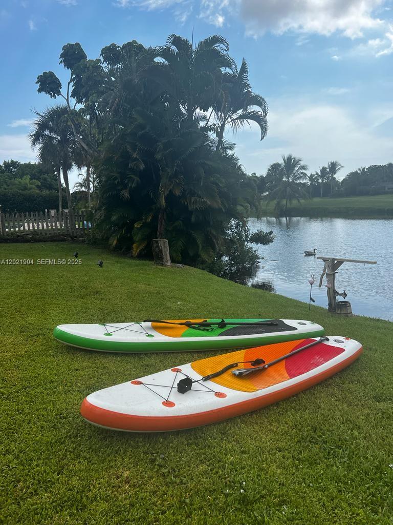 3324 Lakeview Boulevard Delray Beach, FL 33445 - Photo 35 of 36 a view of a lake and yard