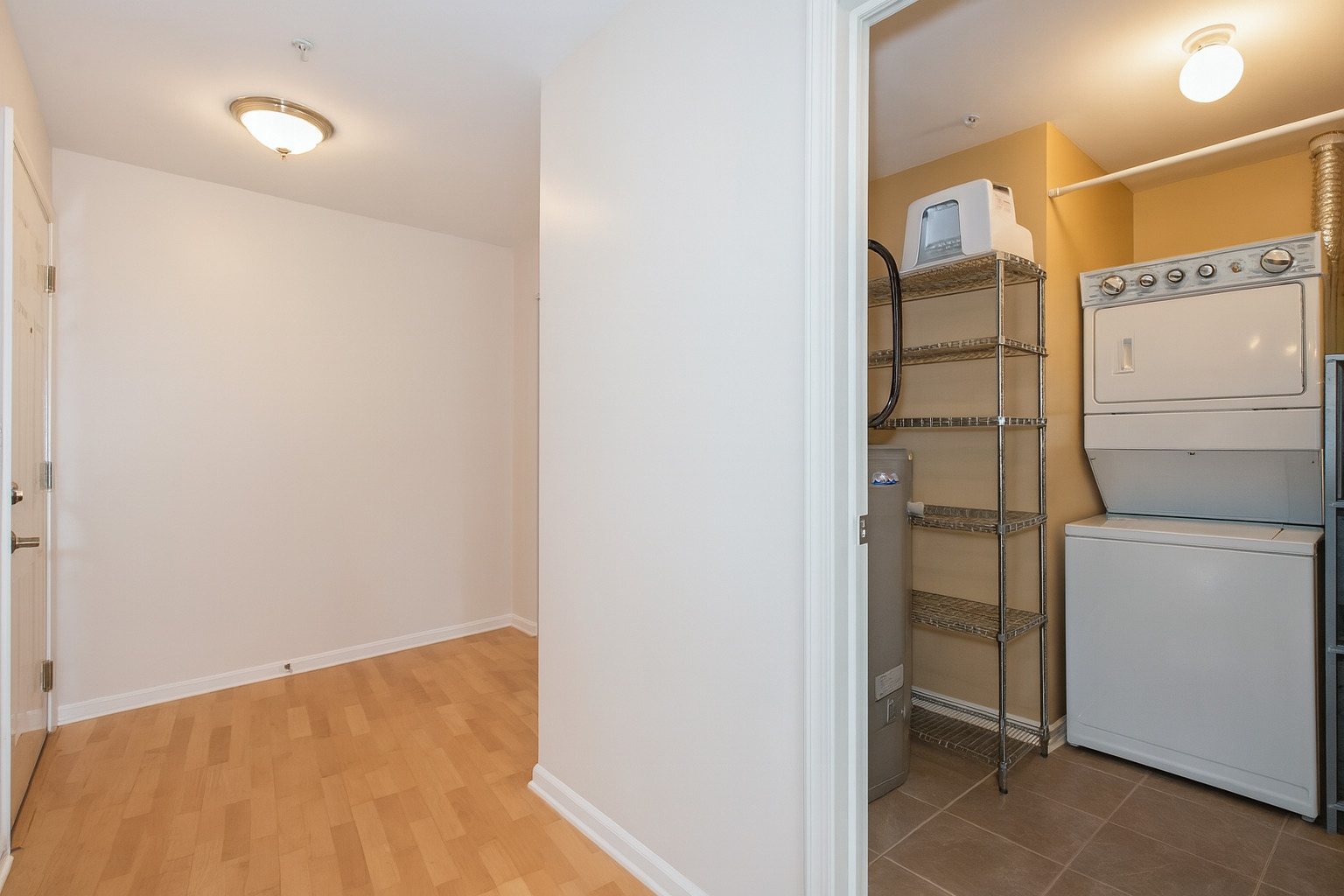 1228 Emerson Street, Unit 304 Evanston, IL 60201 - Photo 14 of 19 a view of walk in closet with empty racks