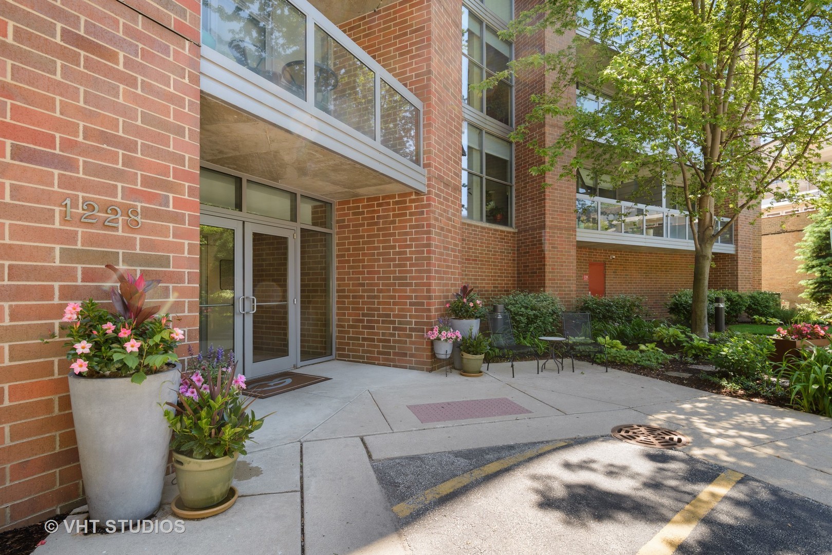 1228 Emerson Street, Unit 304 Evanston, IL 60201 - Photo 16 of 19 a view of a building with a potted plant
