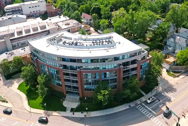 a large building with a sign broad in front of it