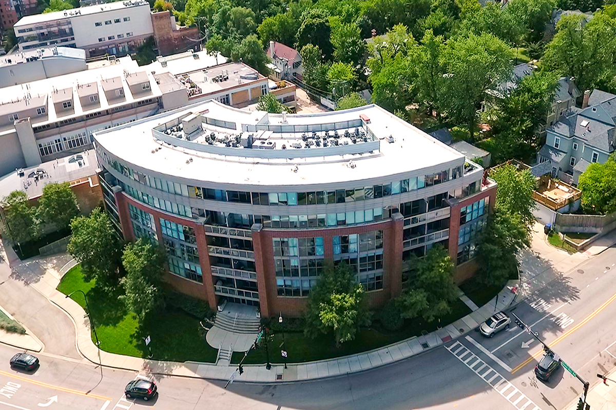 1228 Emerson Street, Unit 304 Evanston, IL 60201 - Photo 17 of 19 a large building with a sign broad in front of it