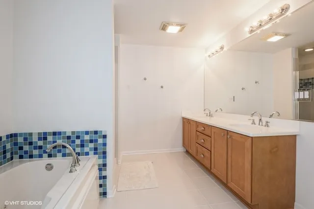 a bathroom with a bathtub and a sink